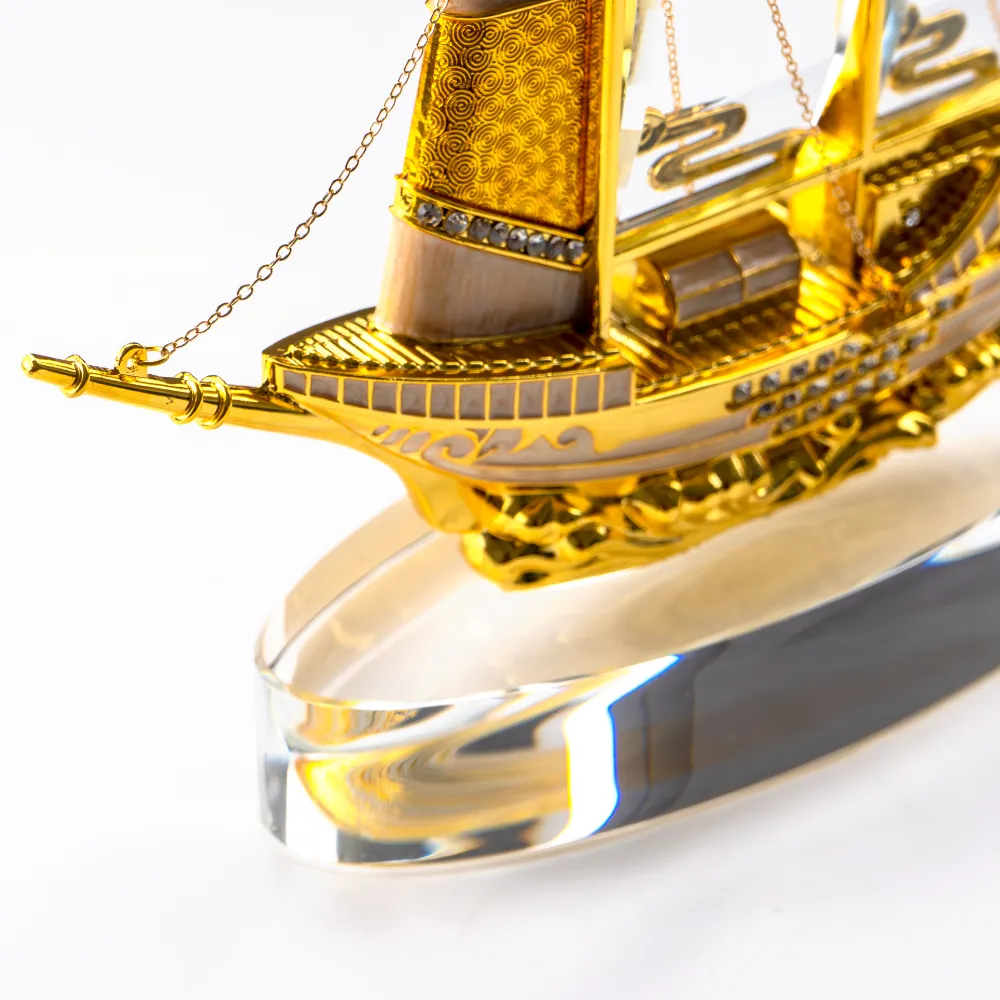Golden Boat-Shaped Memento in Metal with Glass Base