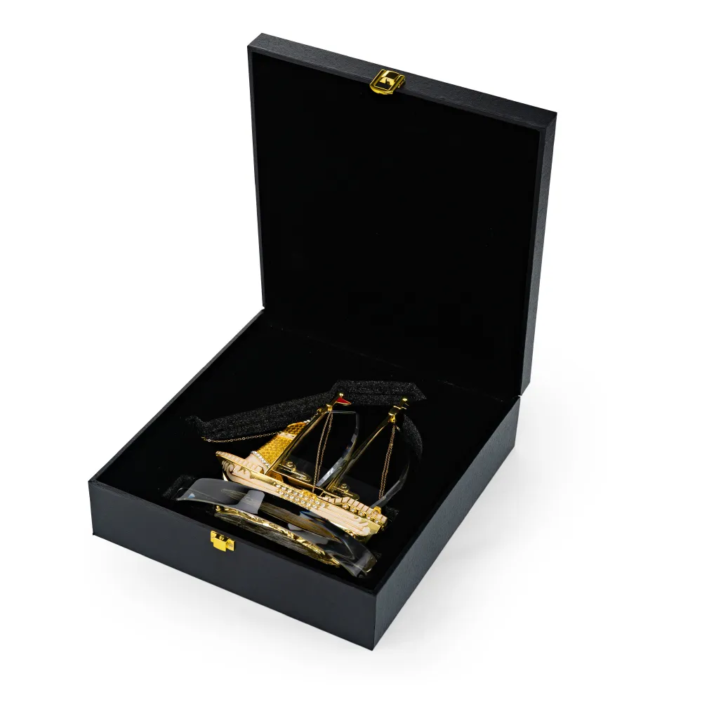 Golden Boat-Shaped Memento in Metal with Glass Base